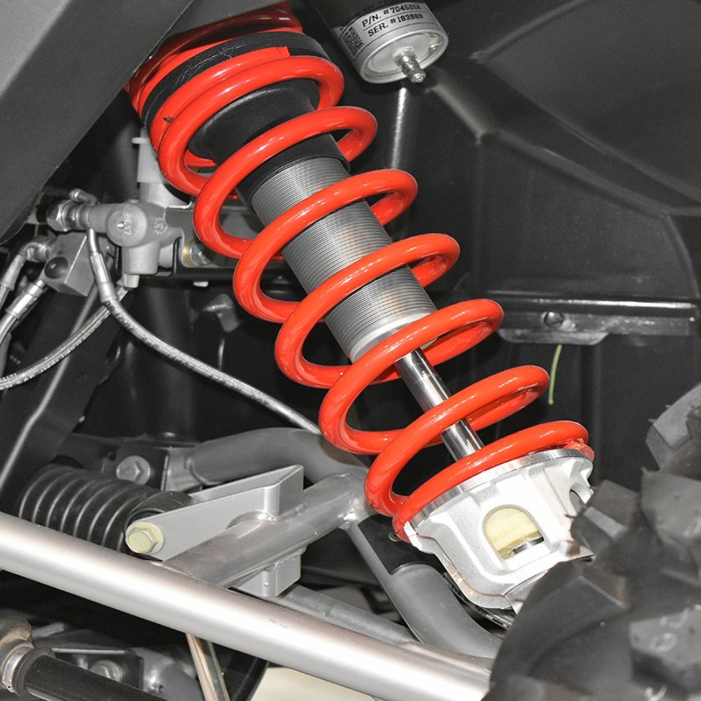 Coilover spring and damper fitted to a car's front suspension